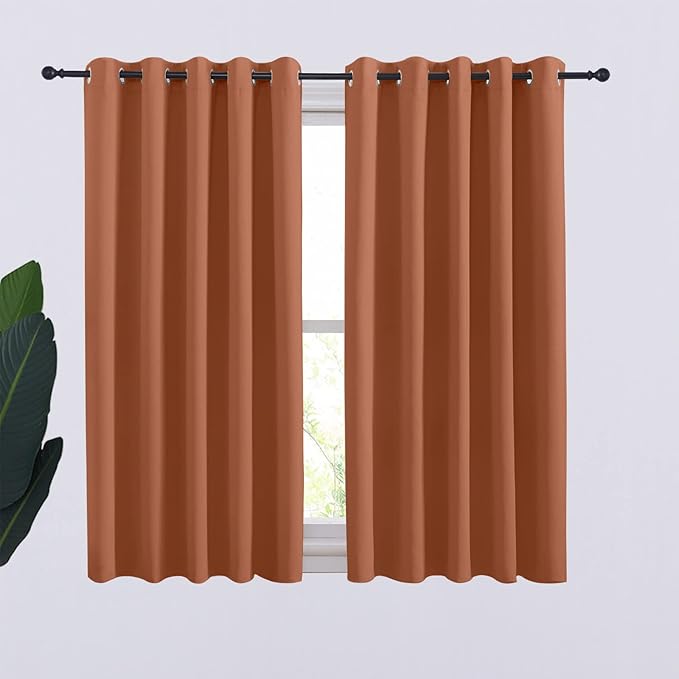 NICETOWN Thermal Insulated Burnt Orange Curtains Blackout Draperies, Window Treatment Solid Grommet Room Darkening Drape Panels for Bedroom (Set of 2, 70 by 54 inches Long)