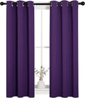 NICETOWN Thermal Insulated Blackout Draperies Curtains, Triple Weave Home Decoration Solid Ring Top Blackout Drape Panels for Bedroom (Set of 2, 29 x 45 Inch, Royal Purple)