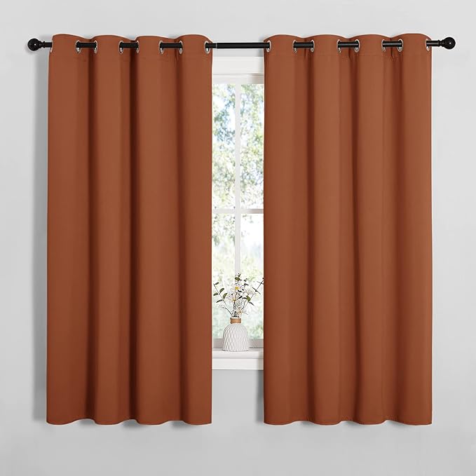 NICETOWN Blackout Curtain Panels for Girls Room, Nursery Essential Thermal Insulated Solid Grommet Top Blackout Drapes (Burnt Orange, 1 Pair, 55 x 68 inches)
