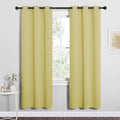 NICETOWN Bedroom Curtain Panels Blackout Draperies, Thermal Insulated Solid Grommet Blackout Curtains/Drapes (Paler Yellow, 1 Pair, 34 by 72-inch)