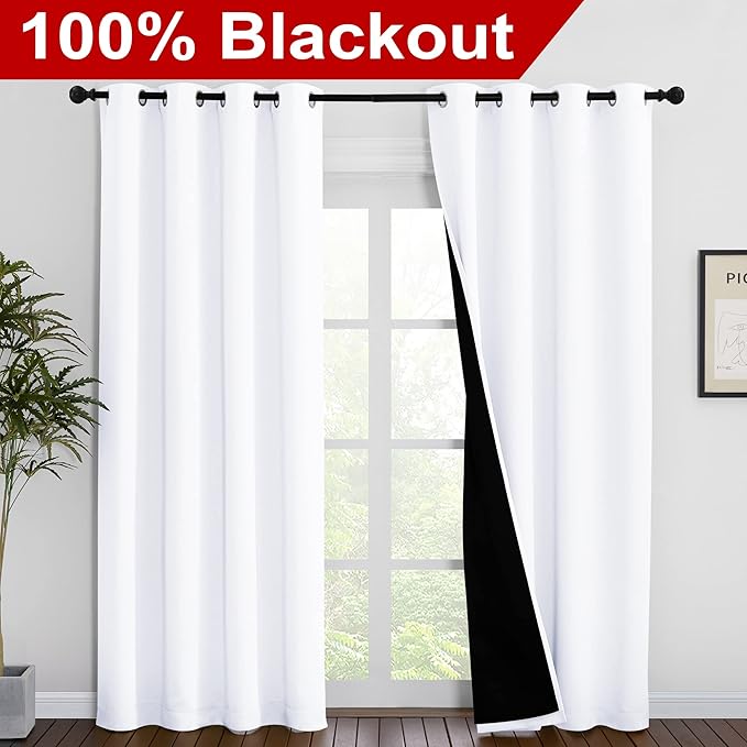 NICETOWN 100% Blackout Window Curtain Panels, Cold and Full Light Blocking Drapes with Black Liner for Nursery, 86 inches Drop Thermal Insulated Draperies (White, 2 Pieces, 55 inches Wide Each Panel)