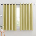 NICETOWN Thermal Insulated Paler Yellow Blackout Curtains for Bedroom, Set of 2, 70 by 63 inches Long, Window Treatment Solid Grommet Room Darkening Drape Panels for Bedroom