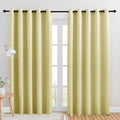 NICETOWN Blackout Draperies Curtains for Kids Room, Paler Yellow, Set of 2, 70 by 84 inches, Window Treatment Thermal Insulated Solid Grommet Blackout Drape Panels for Bedroom