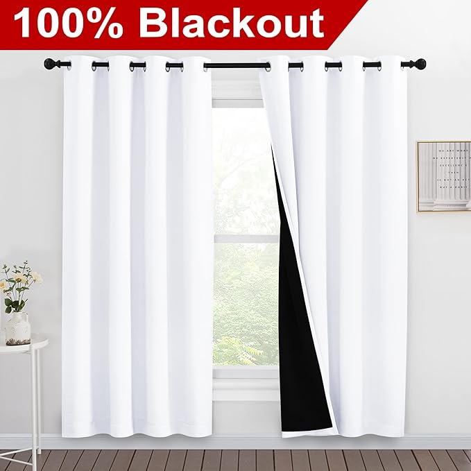 NICETOWN 100% Blackout Window Curtain Panels, Full Light Blocking Drapes with Black Liner for Nursery, 78-inch Drop Thermal Insulated Draperies (White, 2 Pieces, 55-inch Wide Per Panel)