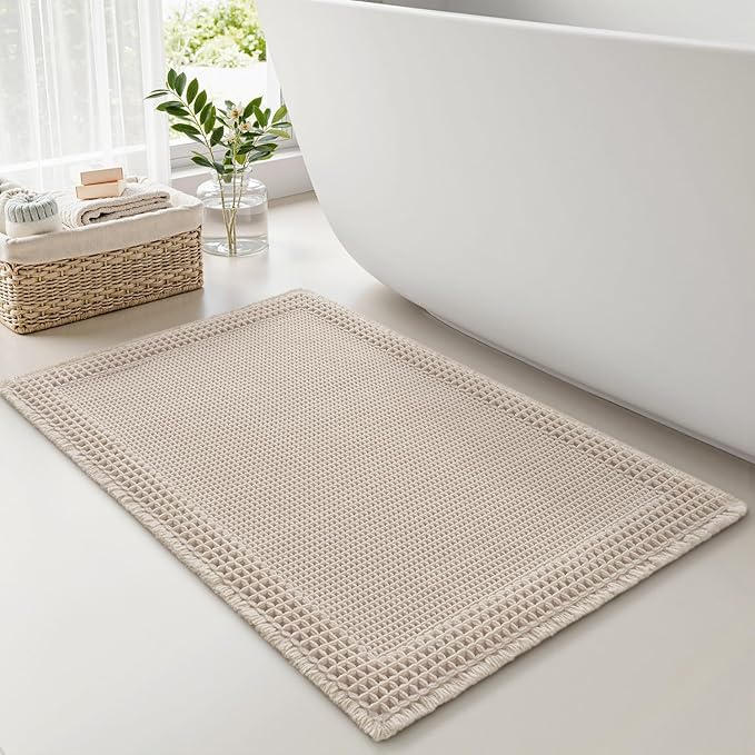 RESARE Waffle Bath Mat for Bathroom, Super Absorbent Bathroom Rugs Non Slip Machine Washable, Ultra Soft Quick Dry Boho Bath Rugs with Tassels for Floor, Upgraded Bordered Design, 18"x30" Pale Beige